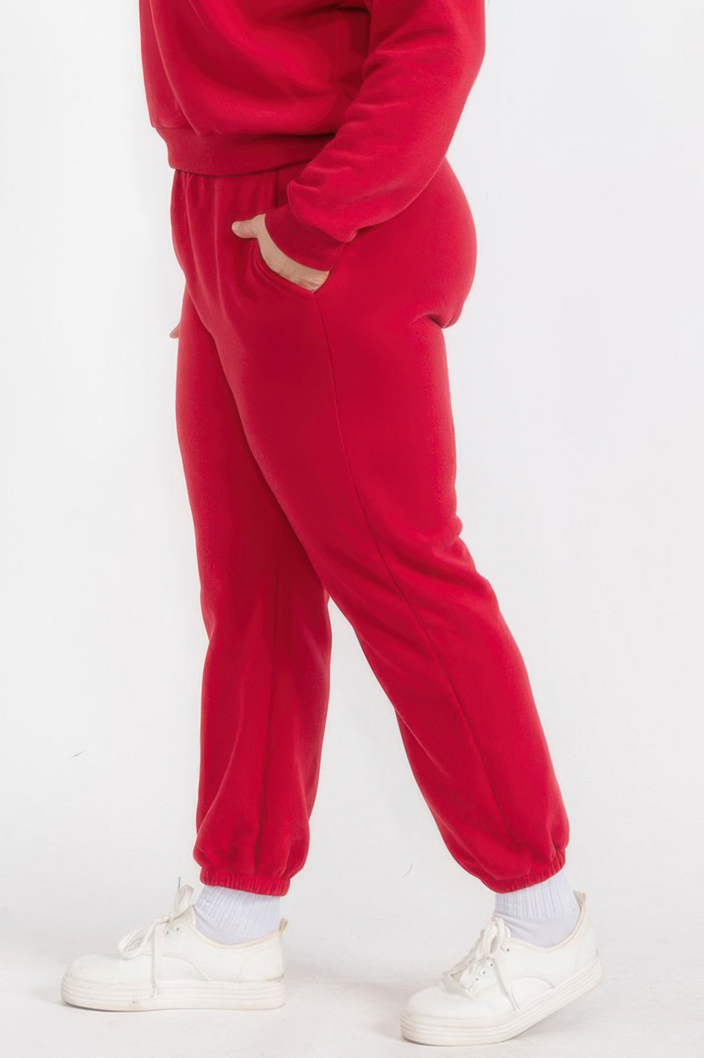 Red fleece joggers with elastic waist, side seam, and cuffed ankle hem