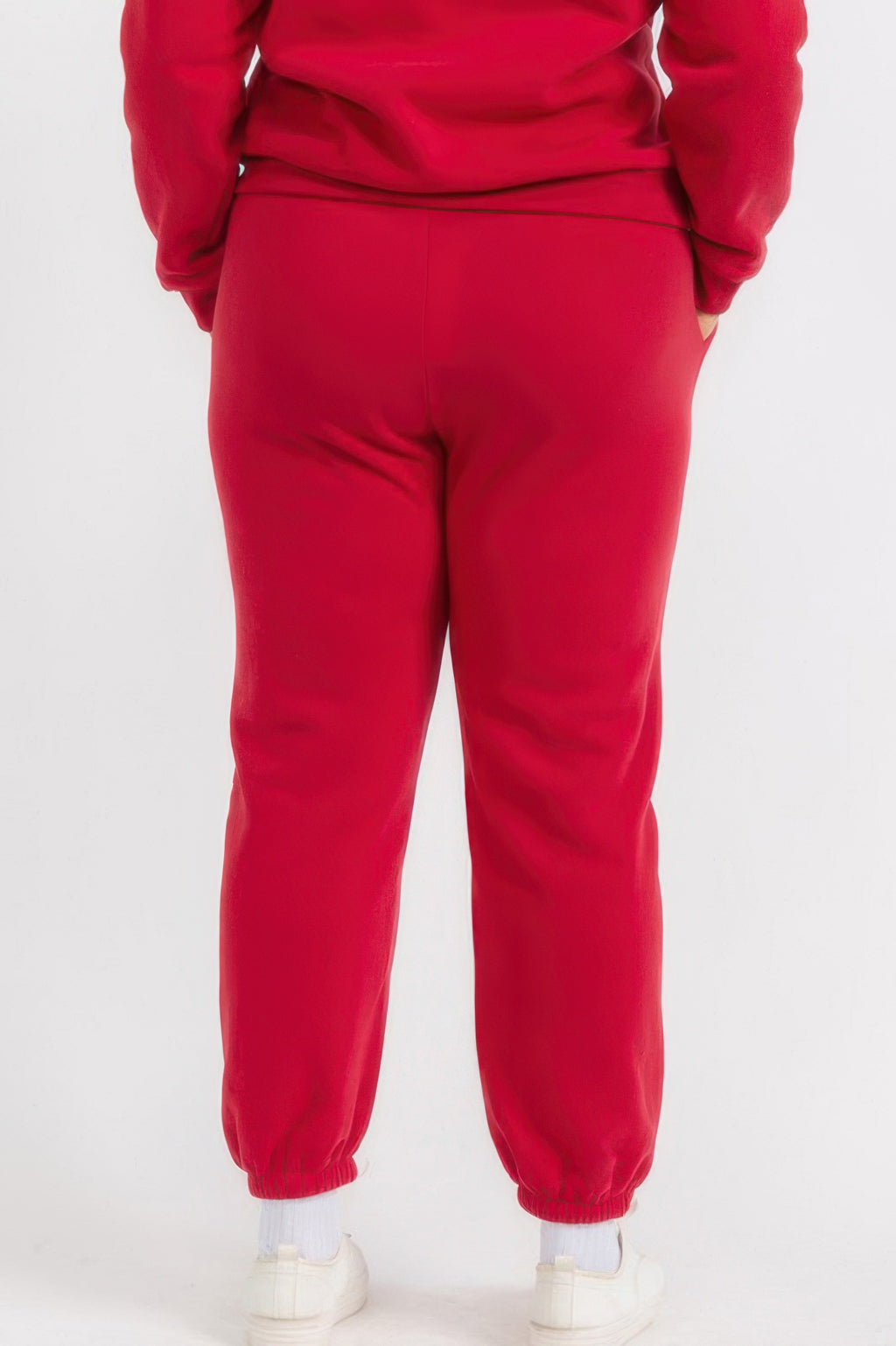 Red plus size joggers with tapered fit, cuffed ankles, and elastic waist