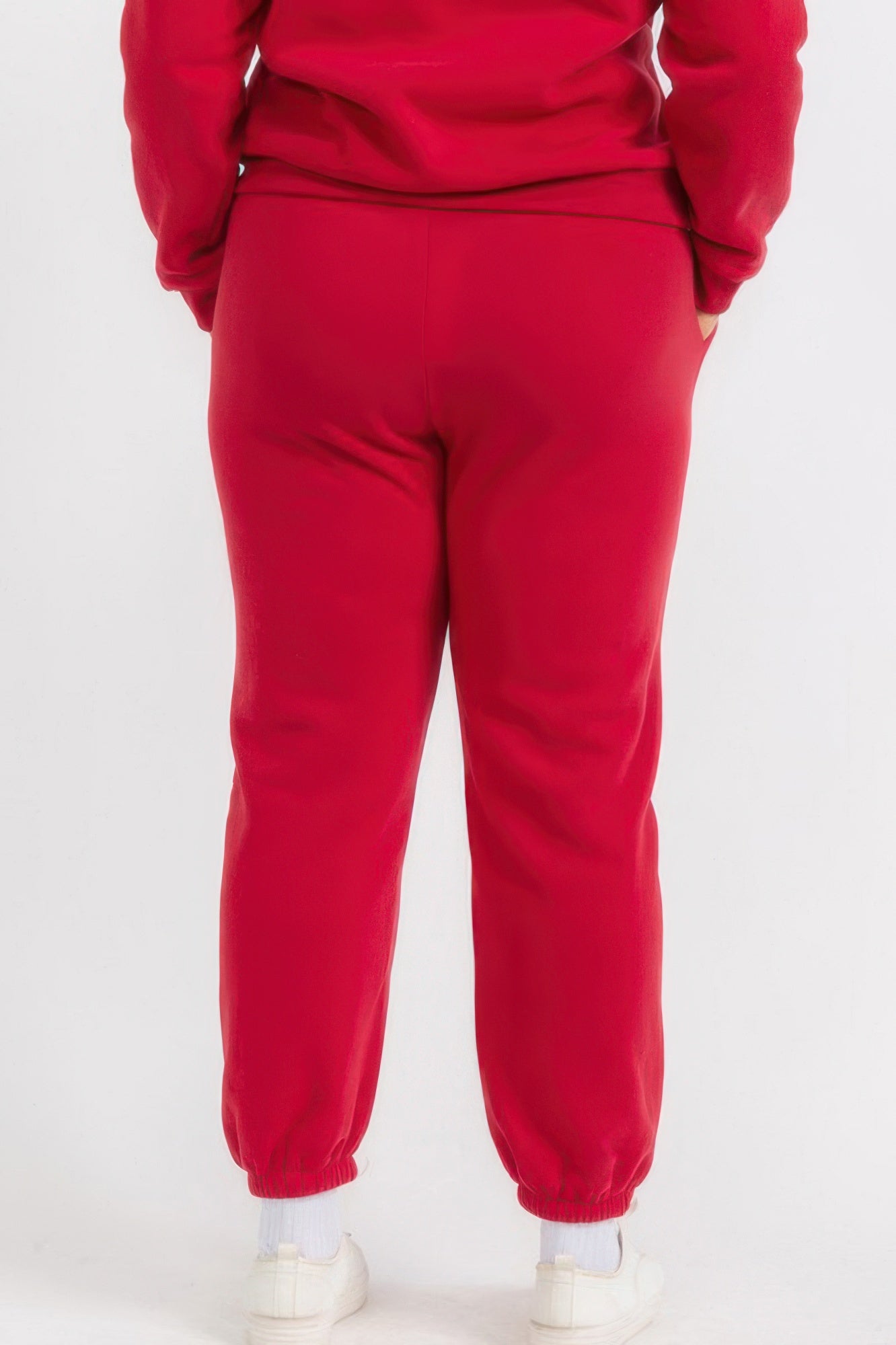 Red plus size joggers with tapered fit, cuffed ankles, and elastic waist