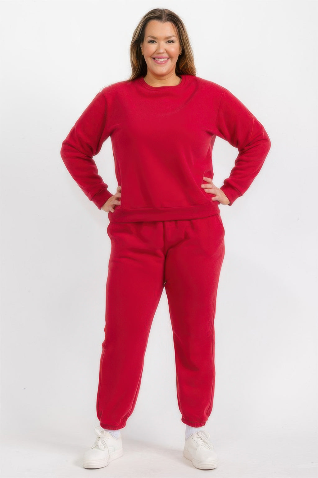Plus size red fleece joggers with elastic waistband and cuffed ankle hems