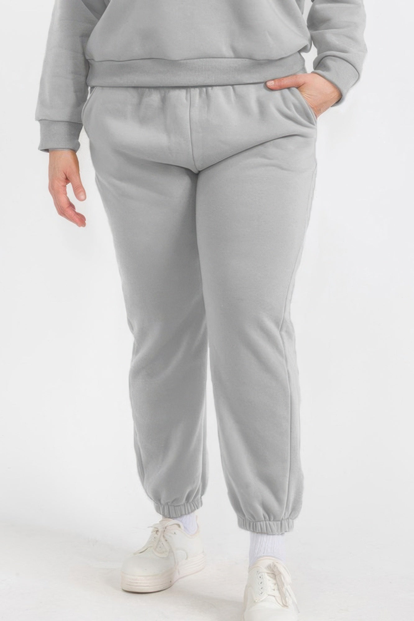 Plus size fleece joggers in heather grey with elastic waistband and cuffed ankle hems