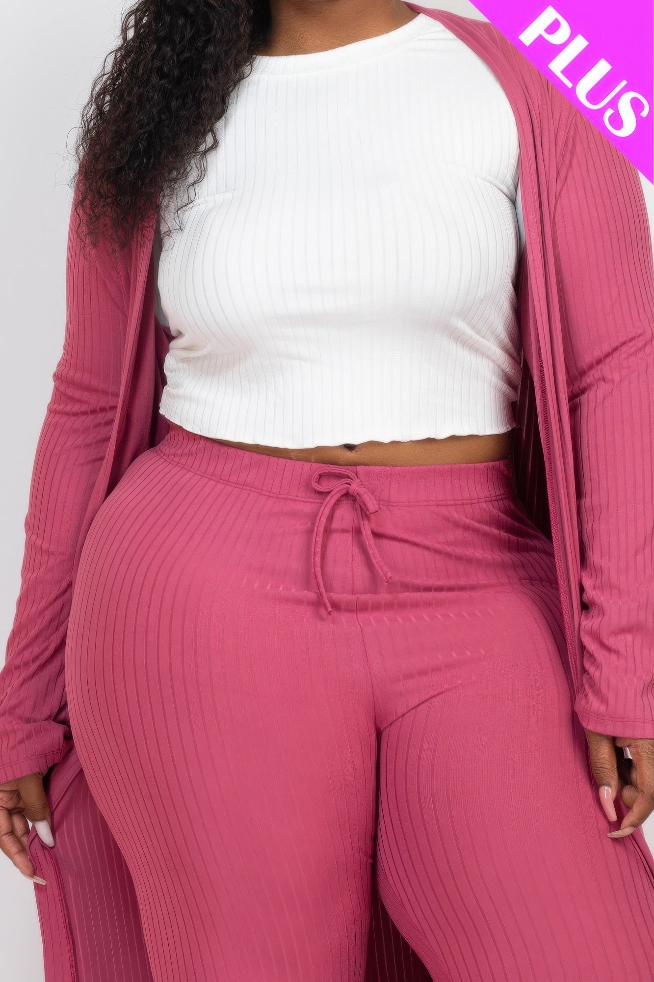 Close-up rose-mauve ribbed leggings with drawstring waist under long cardigan