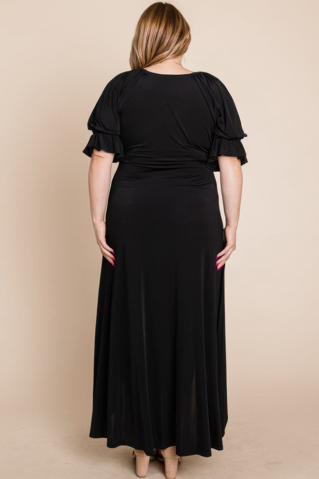 Back view of black faux wrap maxi dress with puff sleeves and ruched waist