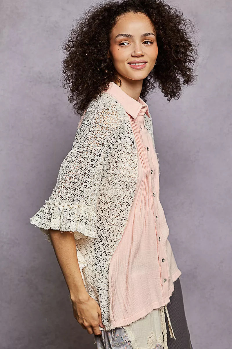 Baby pink button-down shirt with pleated front and crochet patch on sleeves