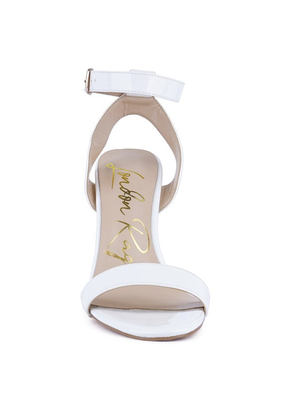 White high-heel sandals with ankle strap and wide crossover straps