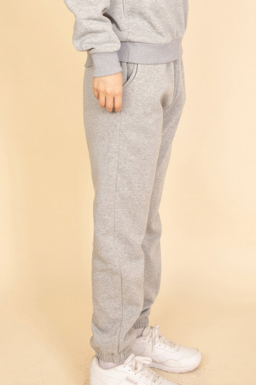 Heather grey joggers side view, elastic waistband and tapered leg with ankle cuff