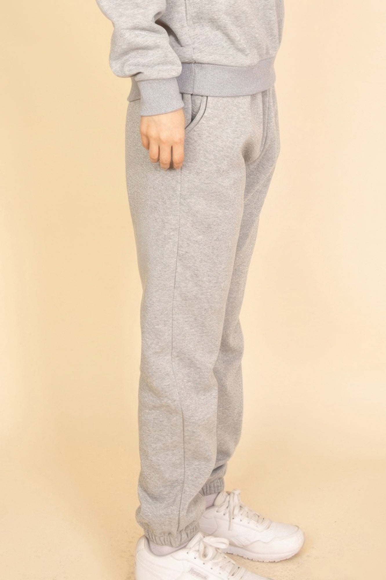 Heather grey joggers side view, elastic waistband and tapered leg with ankle cuff