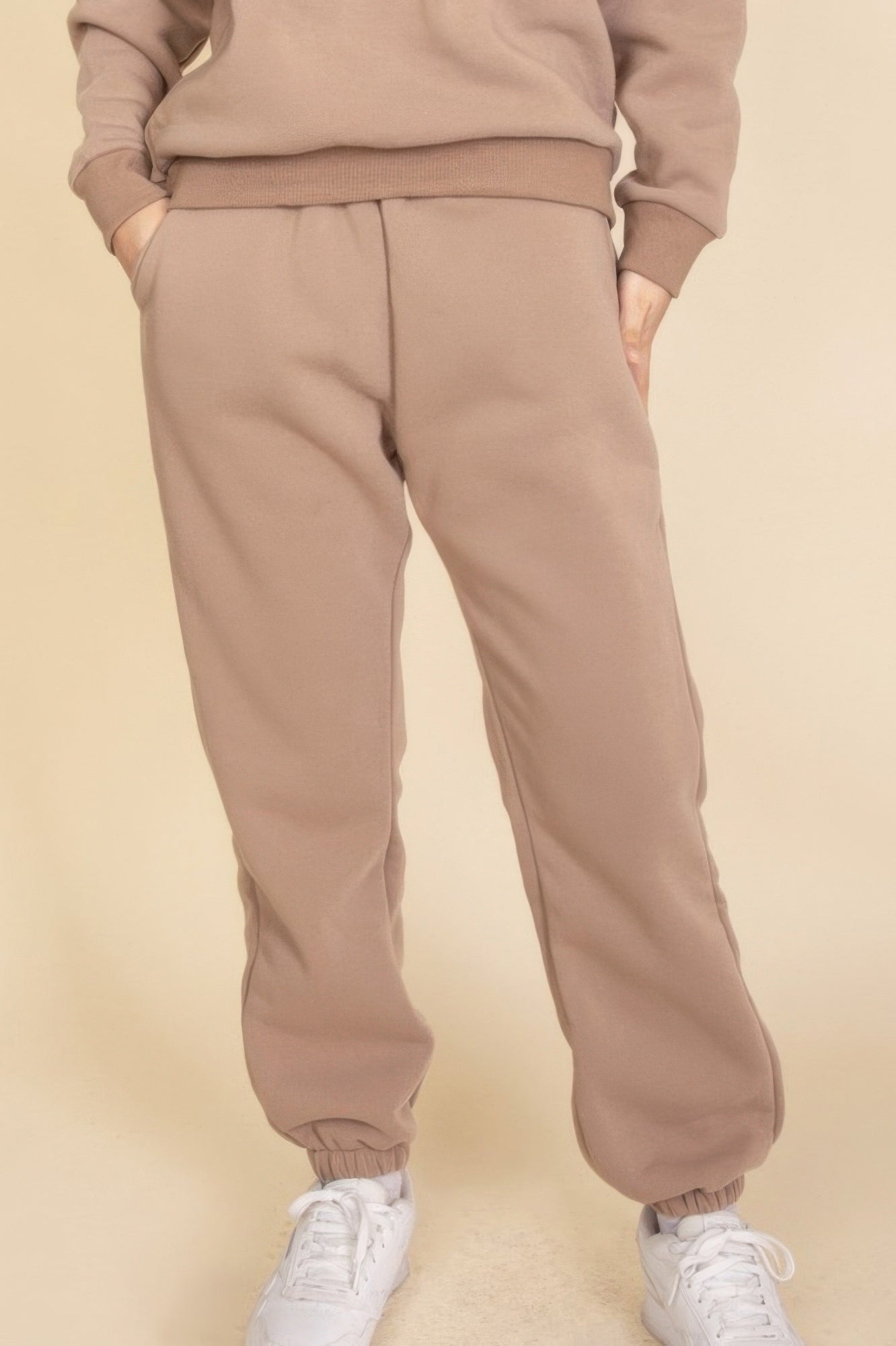 Taupe poly fleece joggers with ribbed elastic waistband and ankle cuffs