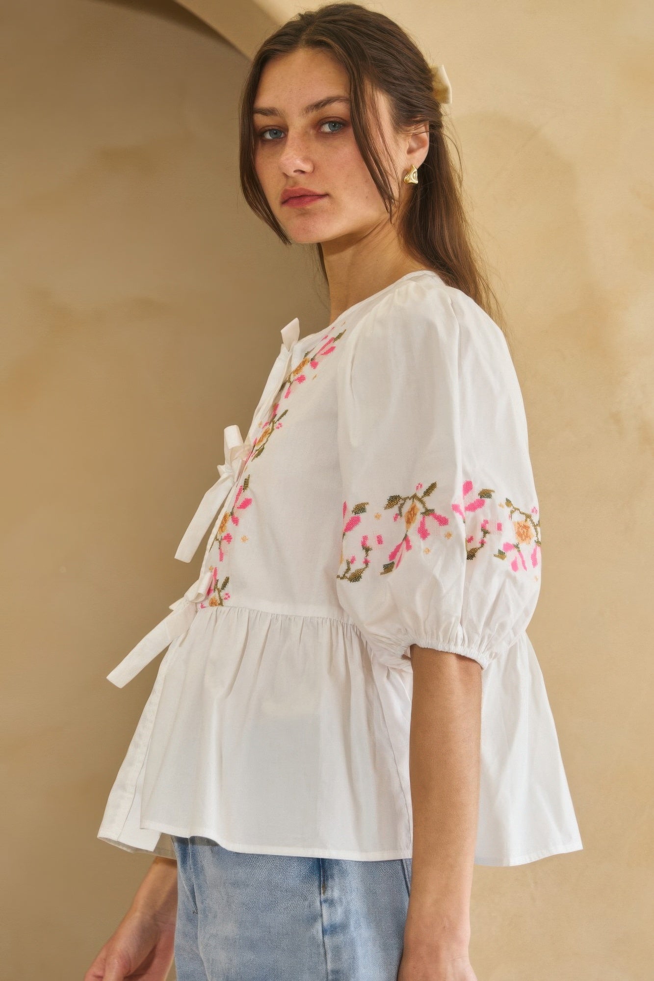 Off-white poplin front ribbon-tie blouse with puff sleeves and floral embroidery