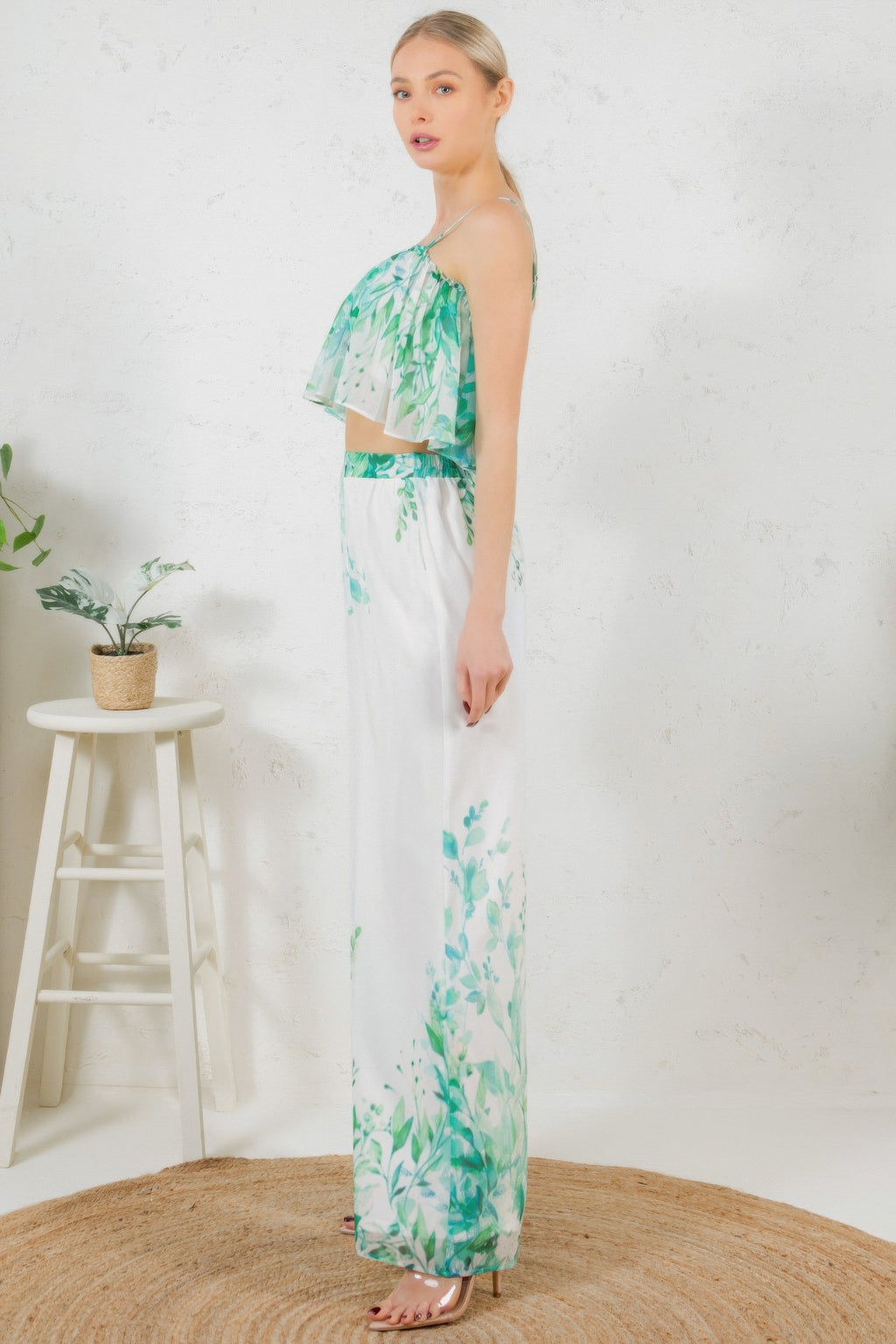 Side view: printed crop top and wide-leg long pants, white with green leafy print