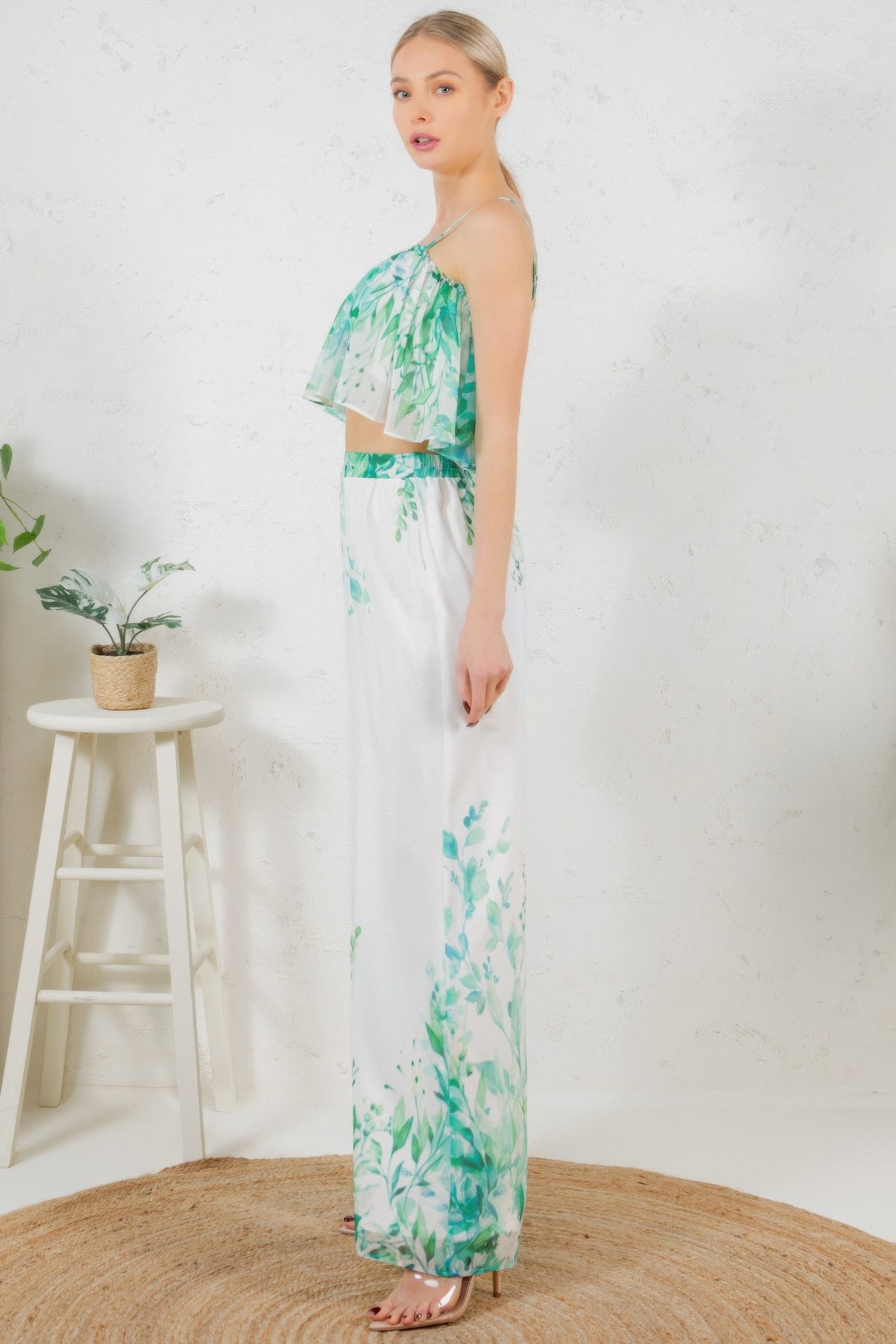 Side view: printed crop top and wide-leg long pants, white with green leafy print