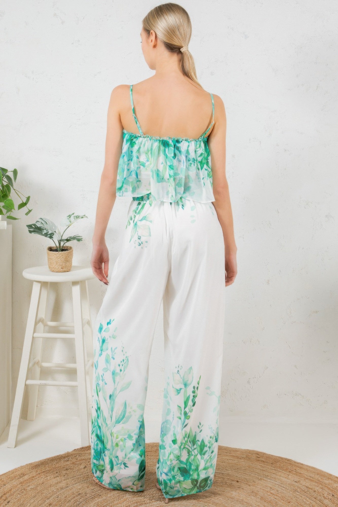Back view of printed crop top and wide-leg long pants set, white with green leaf print