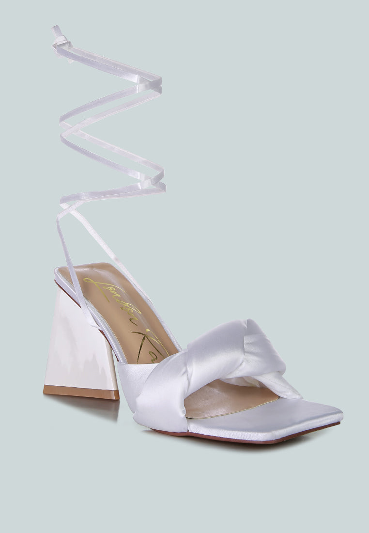 White satin slide sandals with triangular block heel and crisscross ankle strap