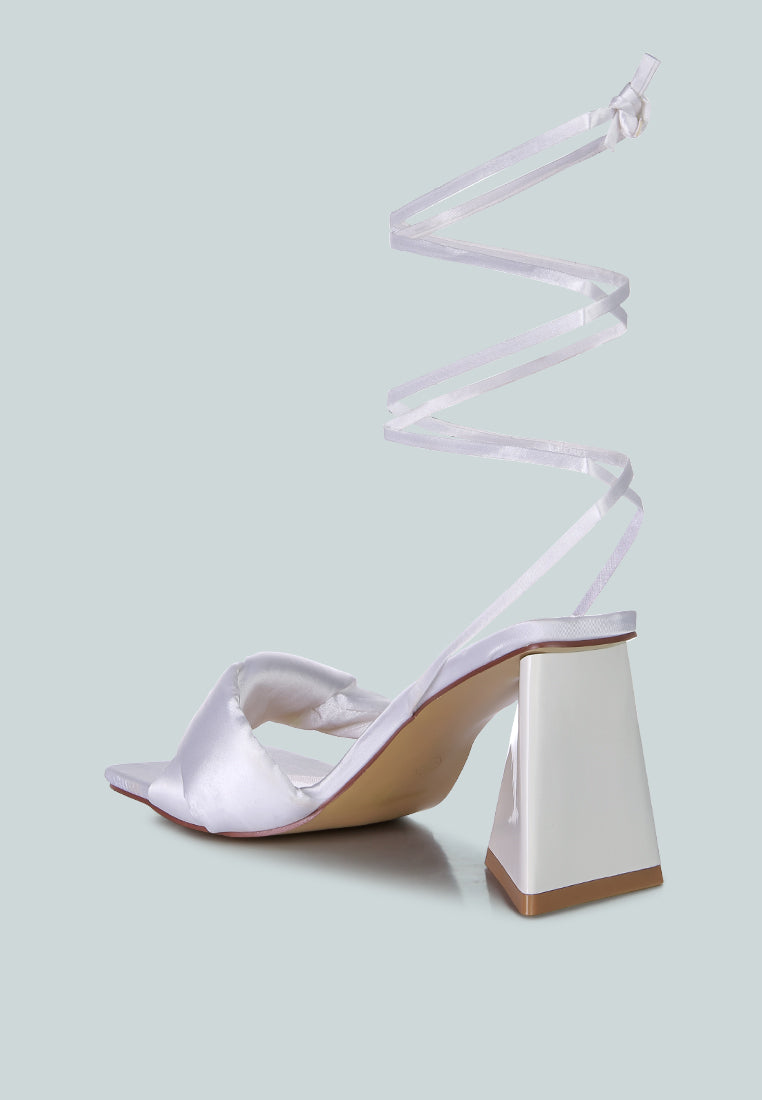 White satin open-toe block heel sandal with ankle tie strap, side view