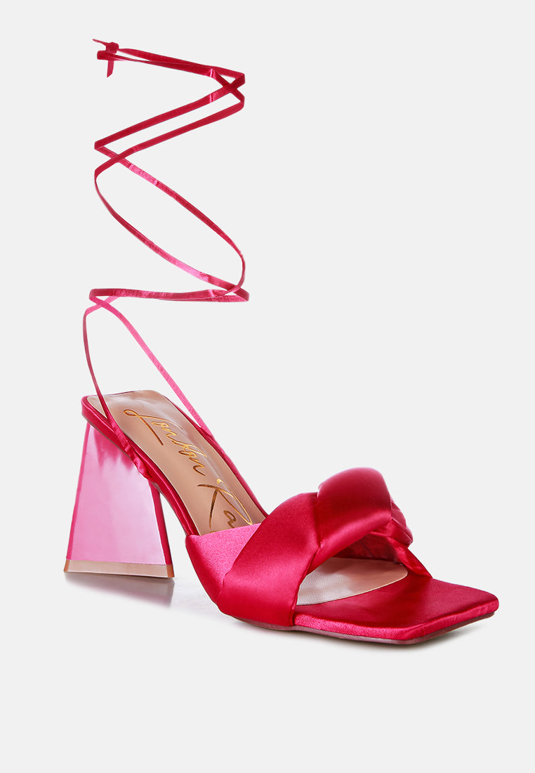 Hot pink satin open-toe sandals with triangular block heel and crisscross straps