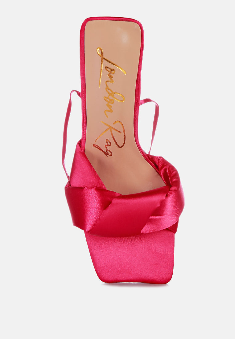 Hot pink satin mule sandal with twisted front straps and block heel