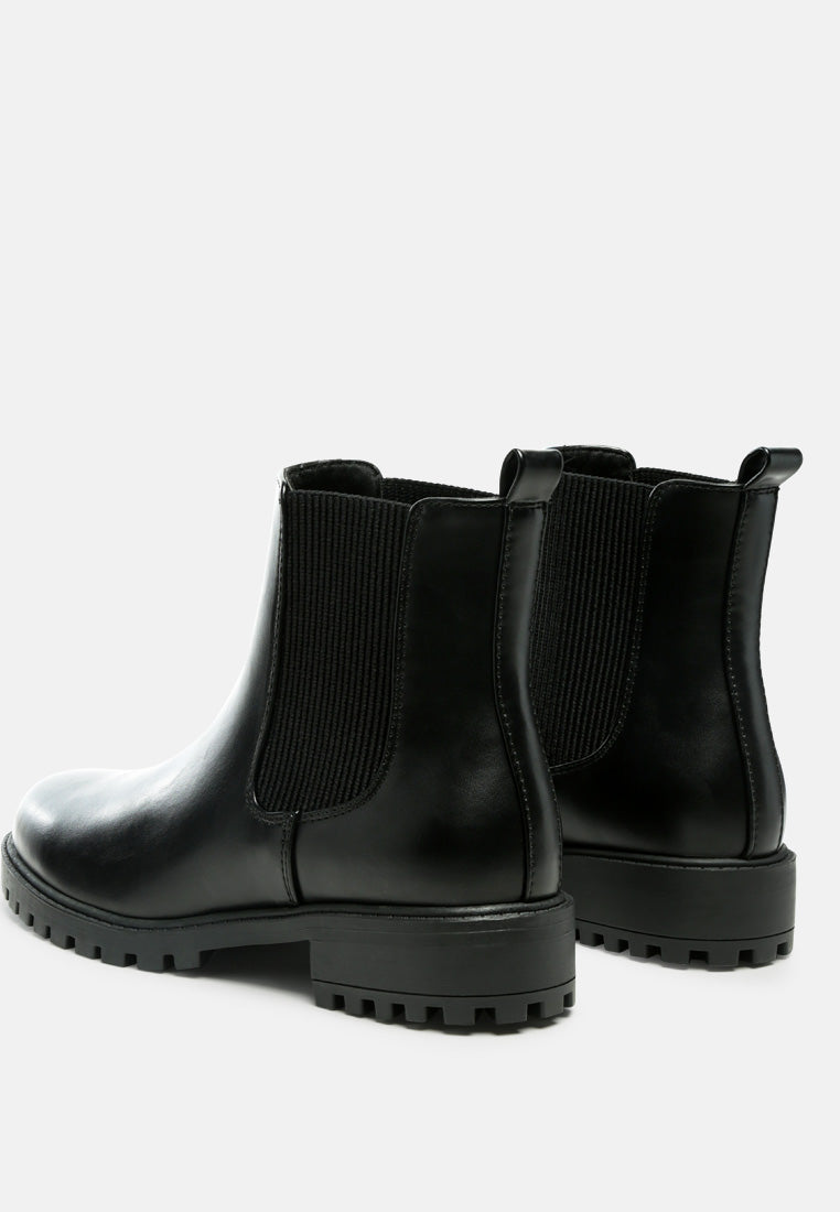 Black Chelsea ankle boots rear view with elastic gore and low block heel lug sole