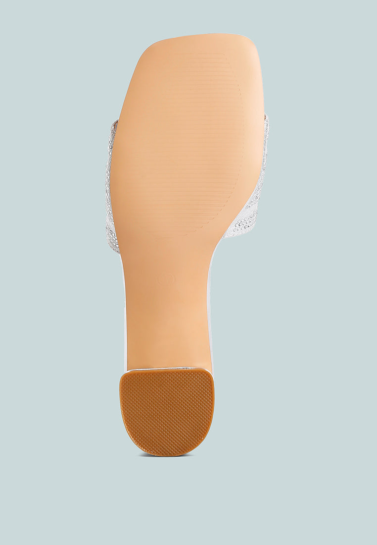 Sole view of silver slide sandal with textured outsole