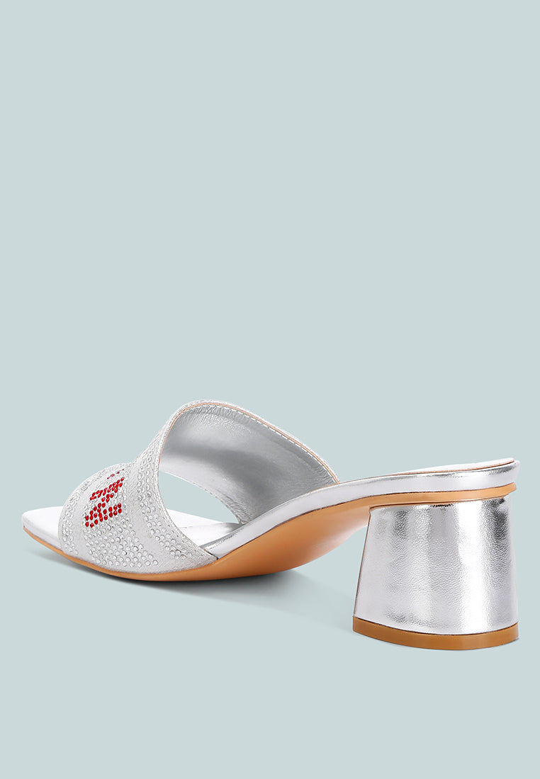 Silver mule sandals with open square toe, metallic block heel, rhinestone strap