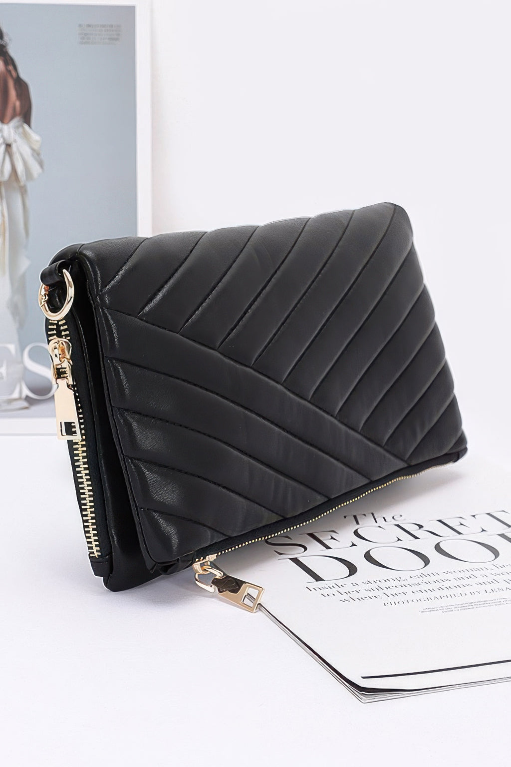 Quilted faux leather half-fold clutch, black with gold zipper pull