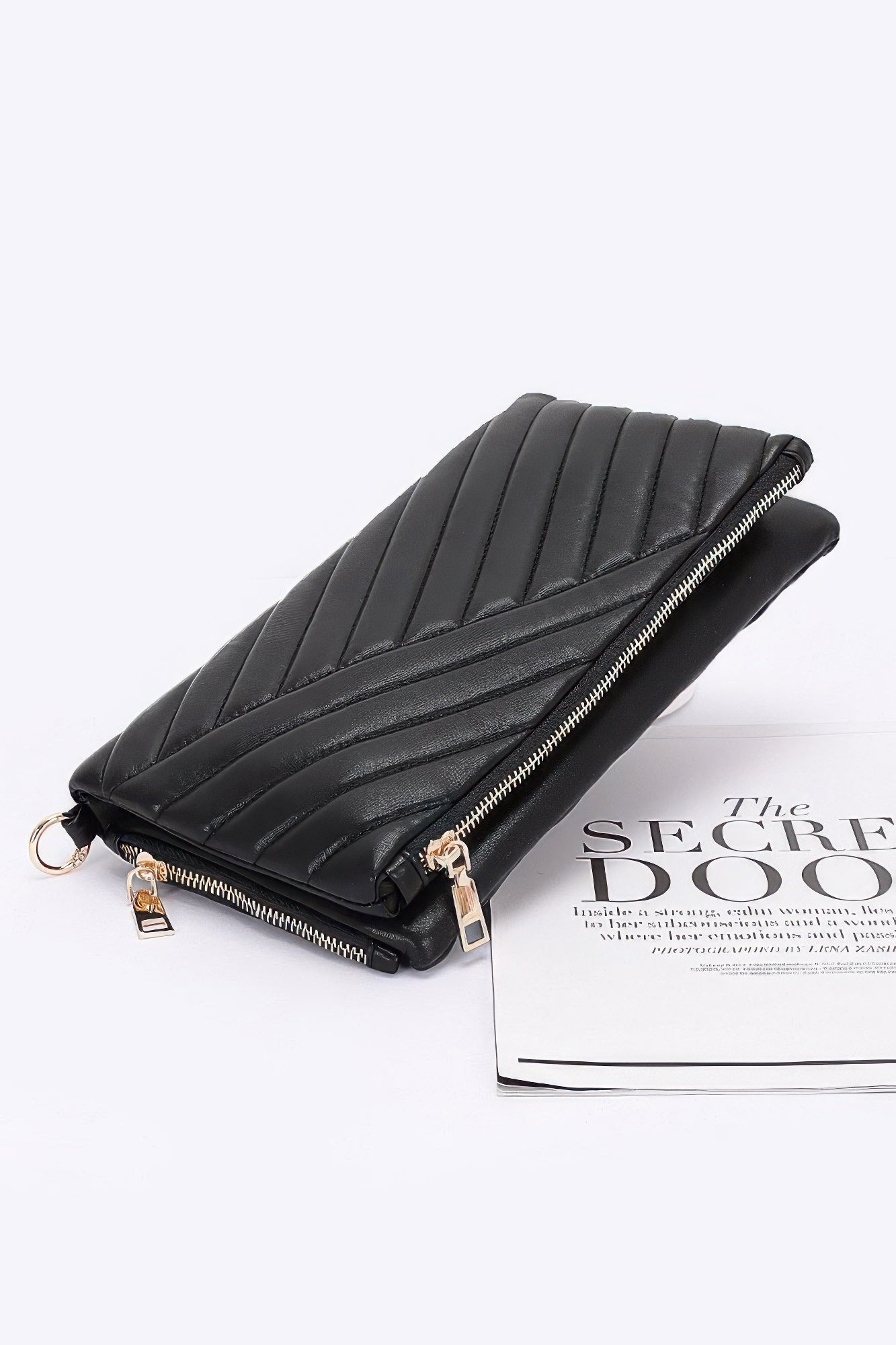 Quilted faux leather half-fold clutch, black with long zipper and ring hardware