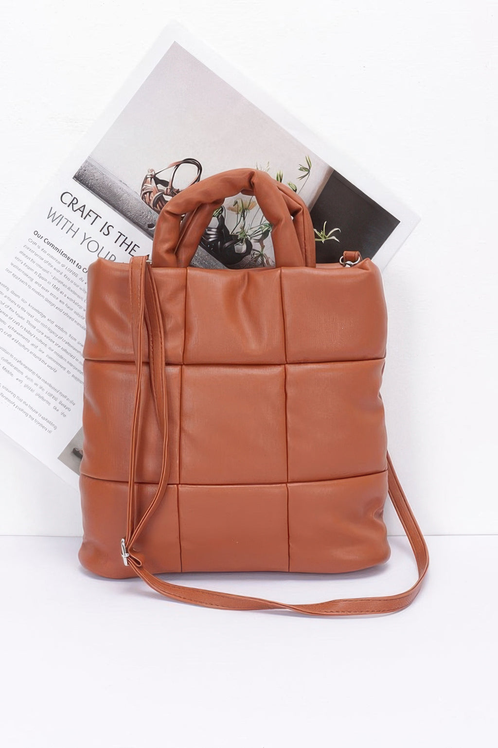 Camel quilted faux leather padded tote bag with top handles and crossbody strap