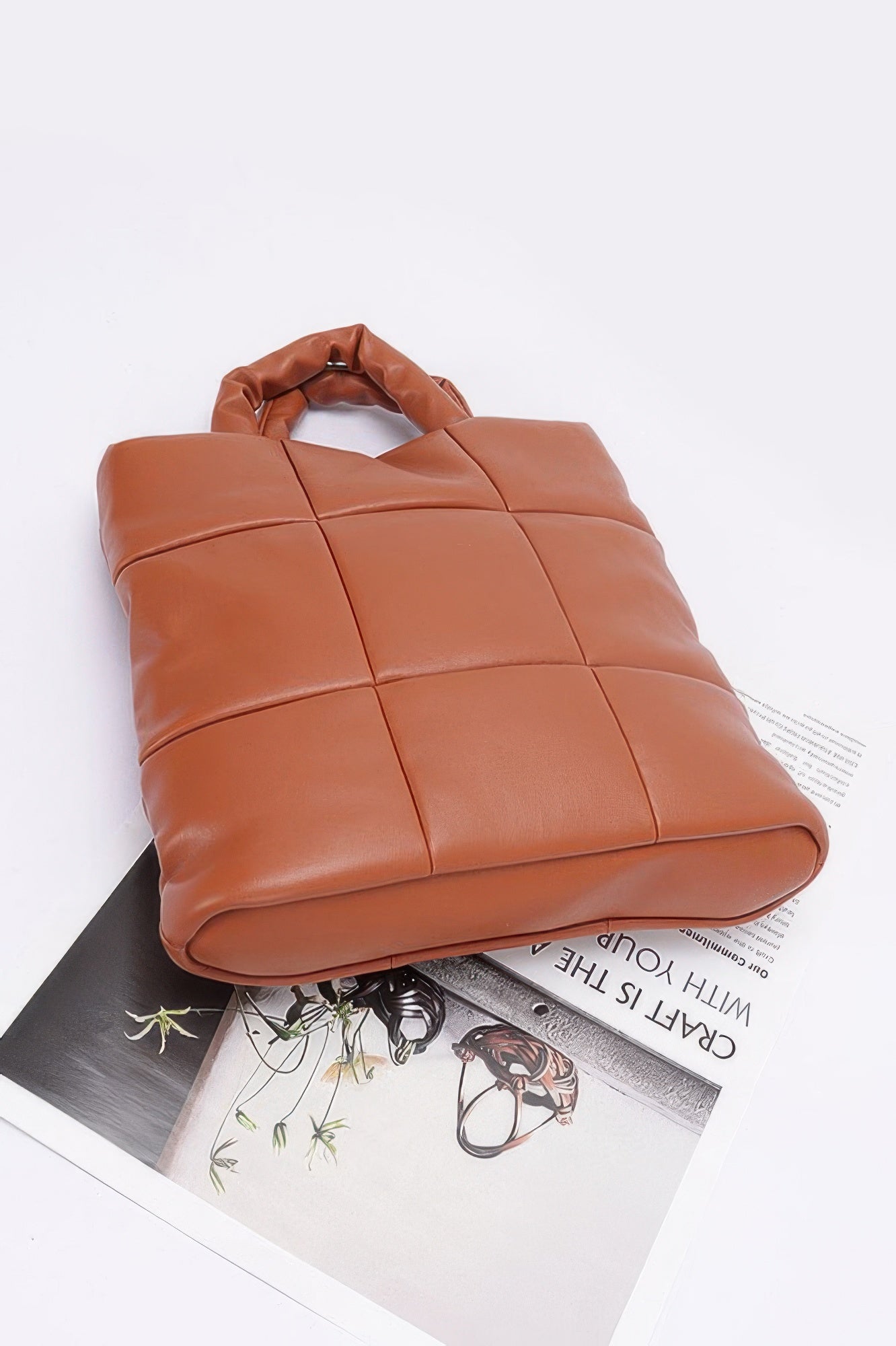 Camel quilted padded tote bag underside view with top handle