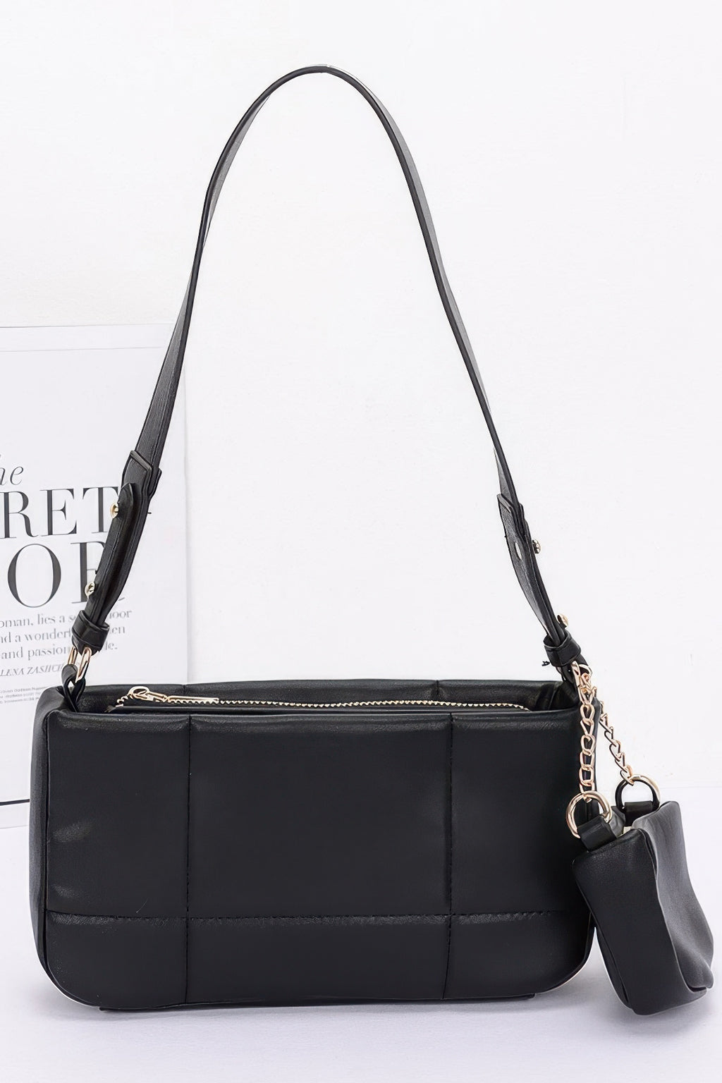 Black quilted faux leather shoulder bag with small AirPods pouch and chain strap