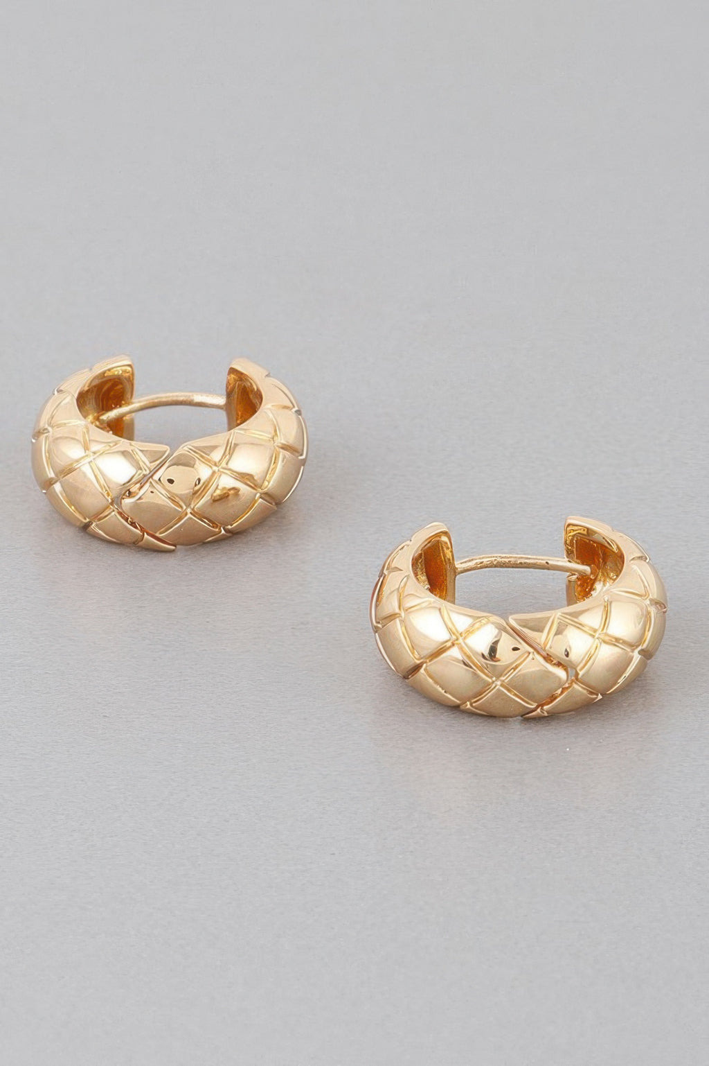 Quilted hoop earrings, gold-tone, hinged clasp detail on textured hoops