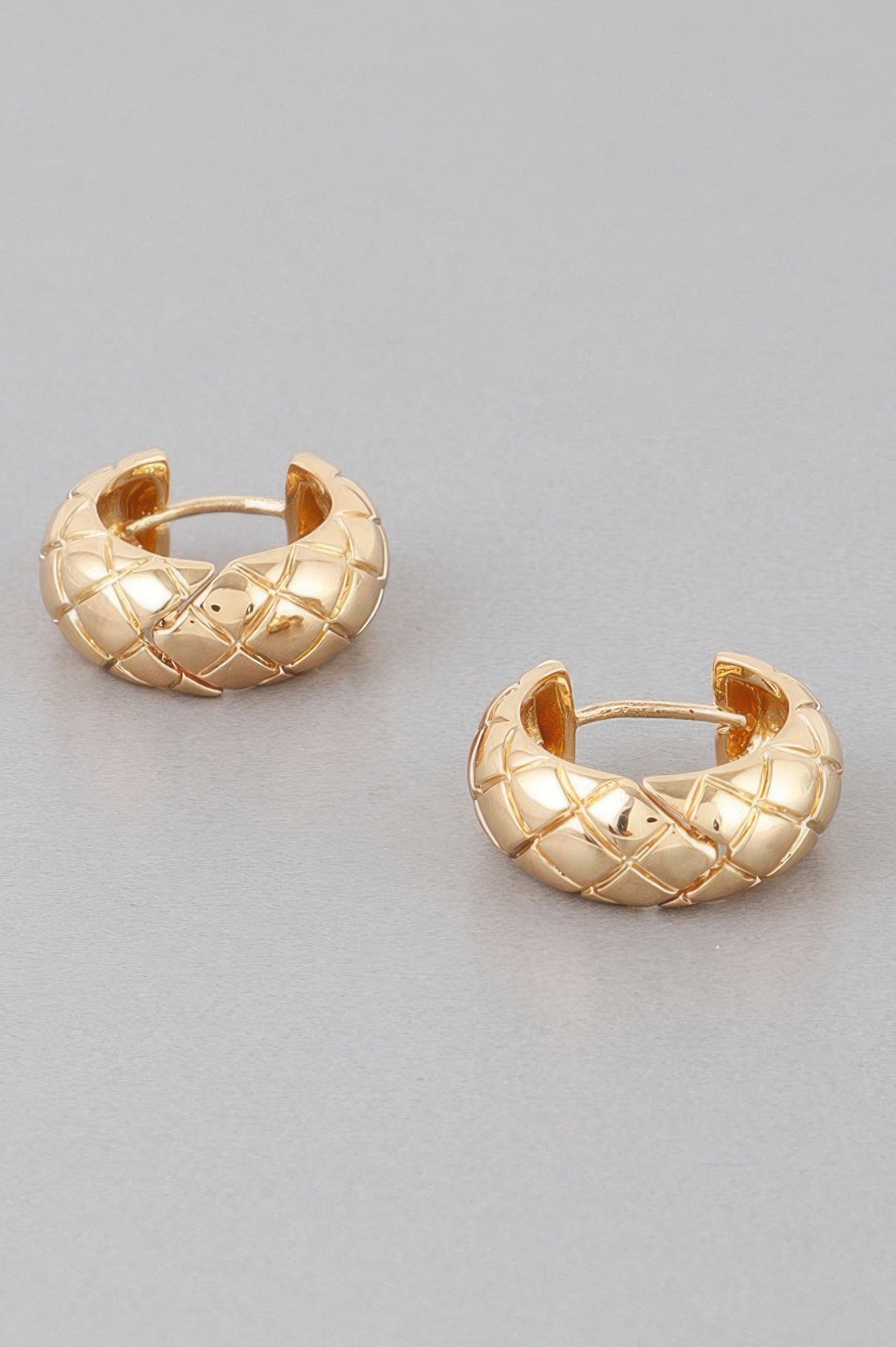 Quilted hoop earrings, gold-tone, hinged clasp detail on textured hoops