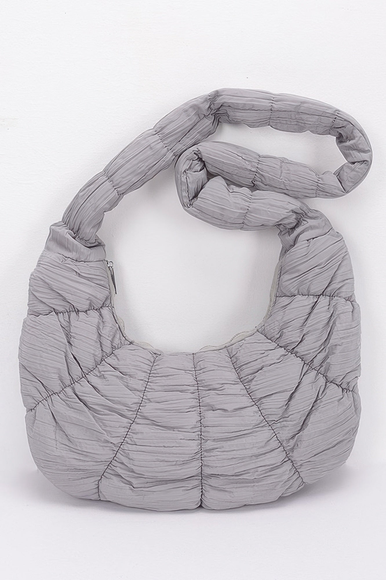 Gray quilted nylon padded crossbody bag with ruched texture and wide strap