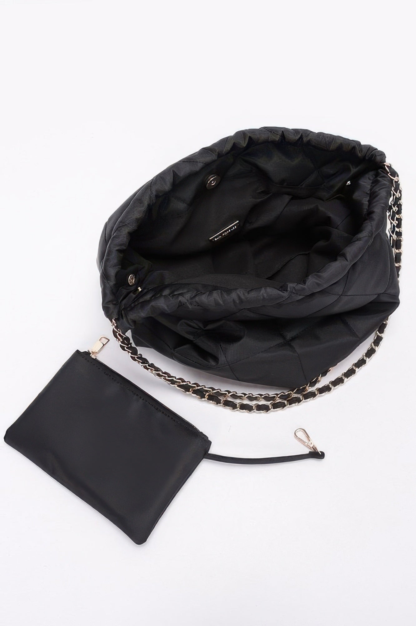Black quilted nylon shoulder bag interior with metal chain strap and small pouch