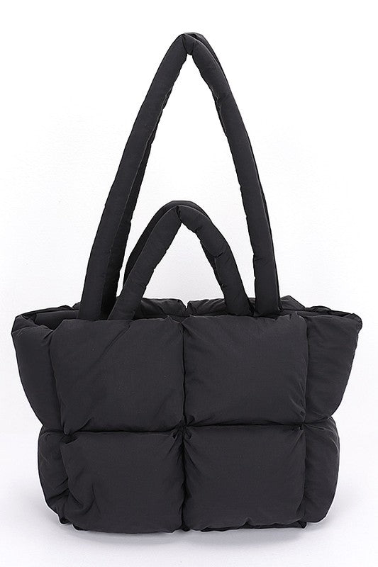 Black quilted puffer convertible tote bag with dual top handles and quilted cubes