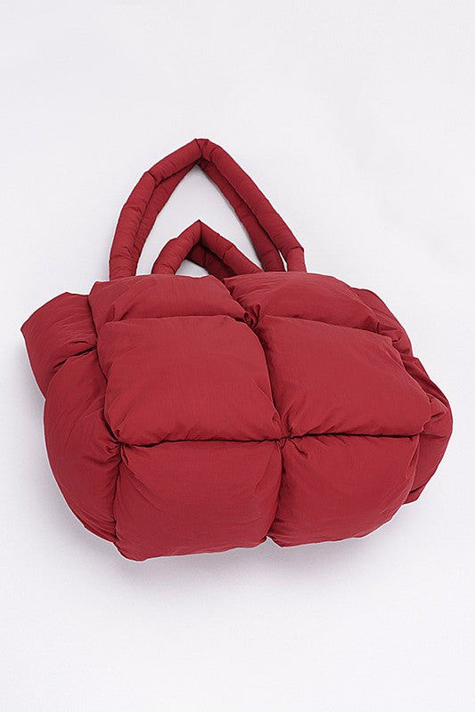 Burgundy quilted puffer convertible tote bag with two top handles and front seam detailing