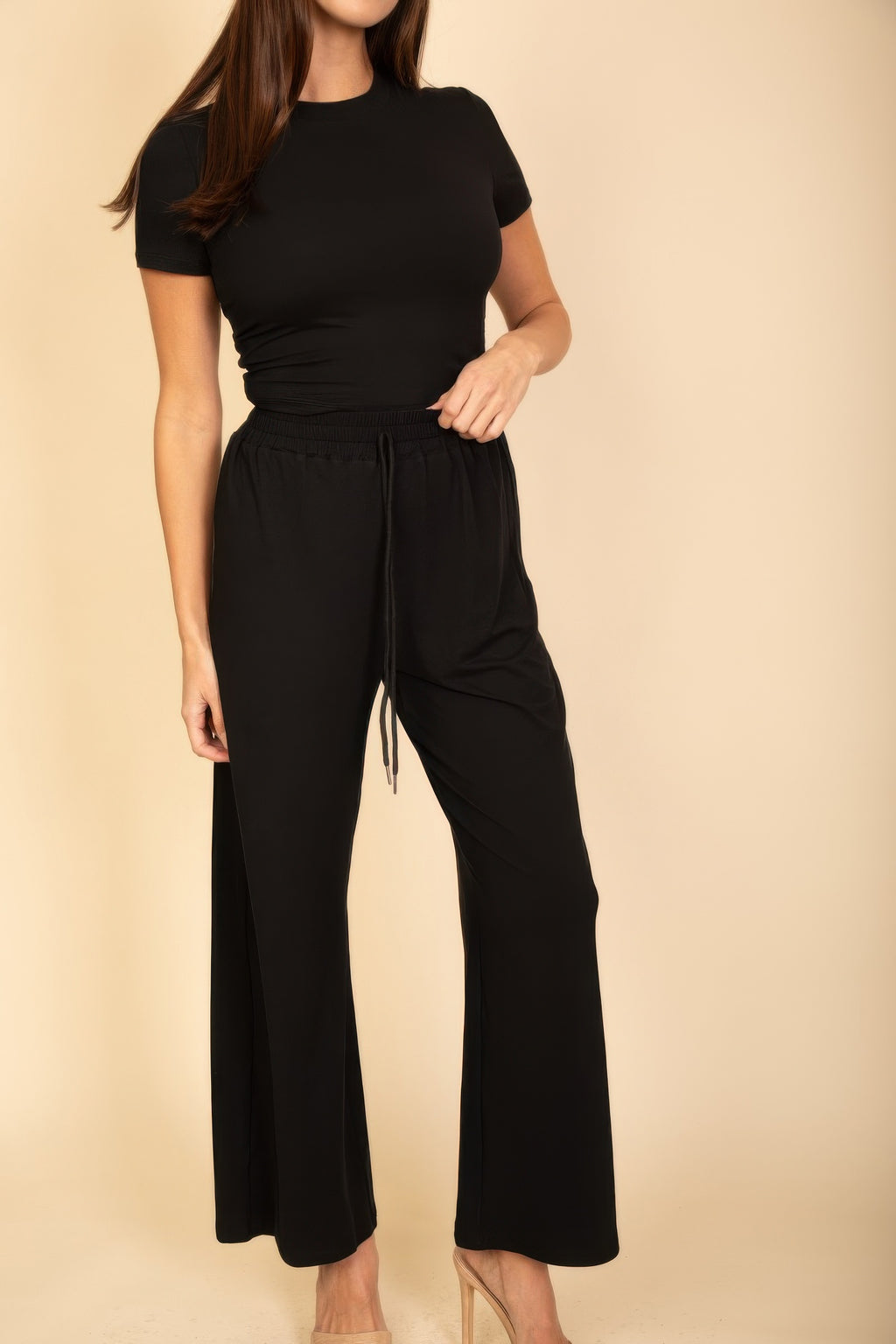 Black sleeved top and wide-leg pants set with elastic waist and subtle drawcord