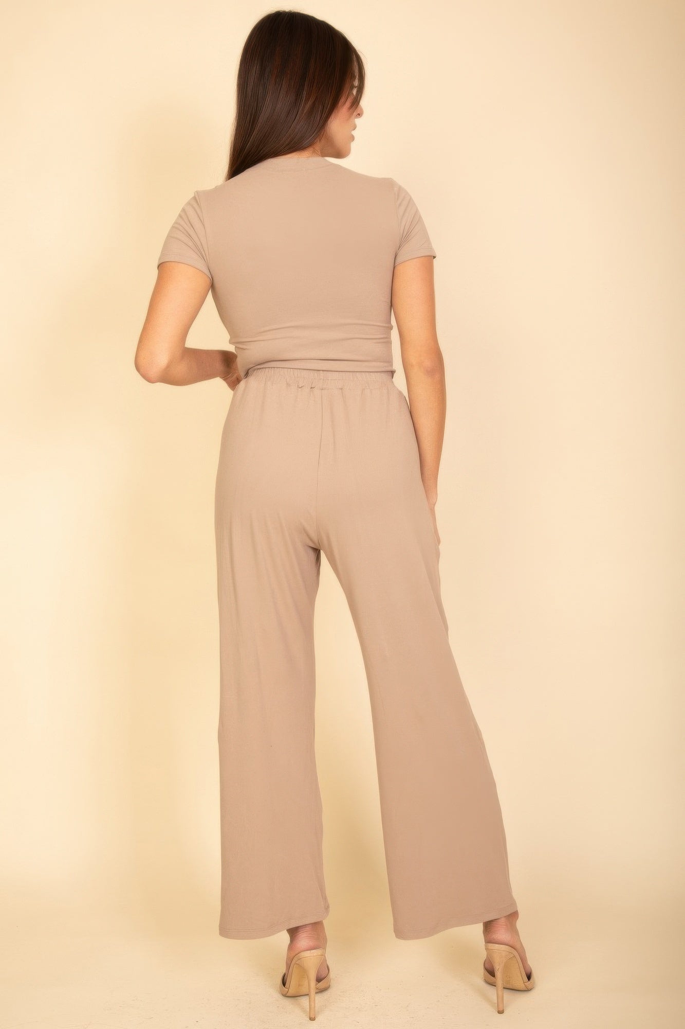 Taupe back view: crew-neck top with elastic waist and wide-leg pants with drawcord