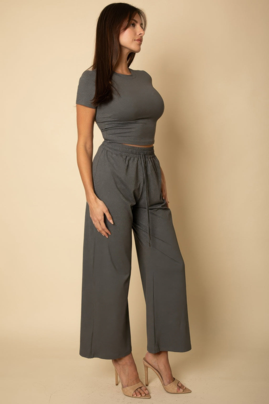Heather grey relaxed fit top and wide-leg pants, side profile showing elastic waist and tie ends