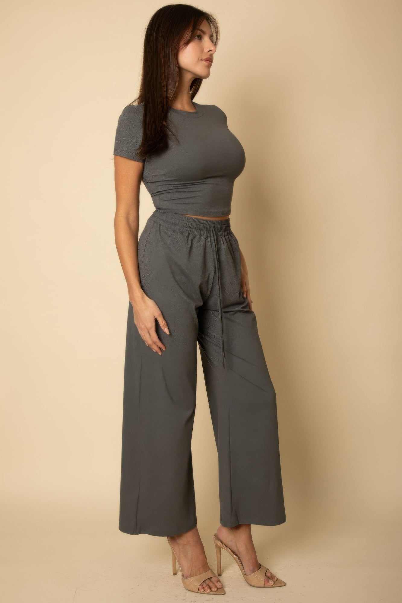Heather grey relaxed fit top and wide-leg pants, side profile showing elastic waist and tie ends
