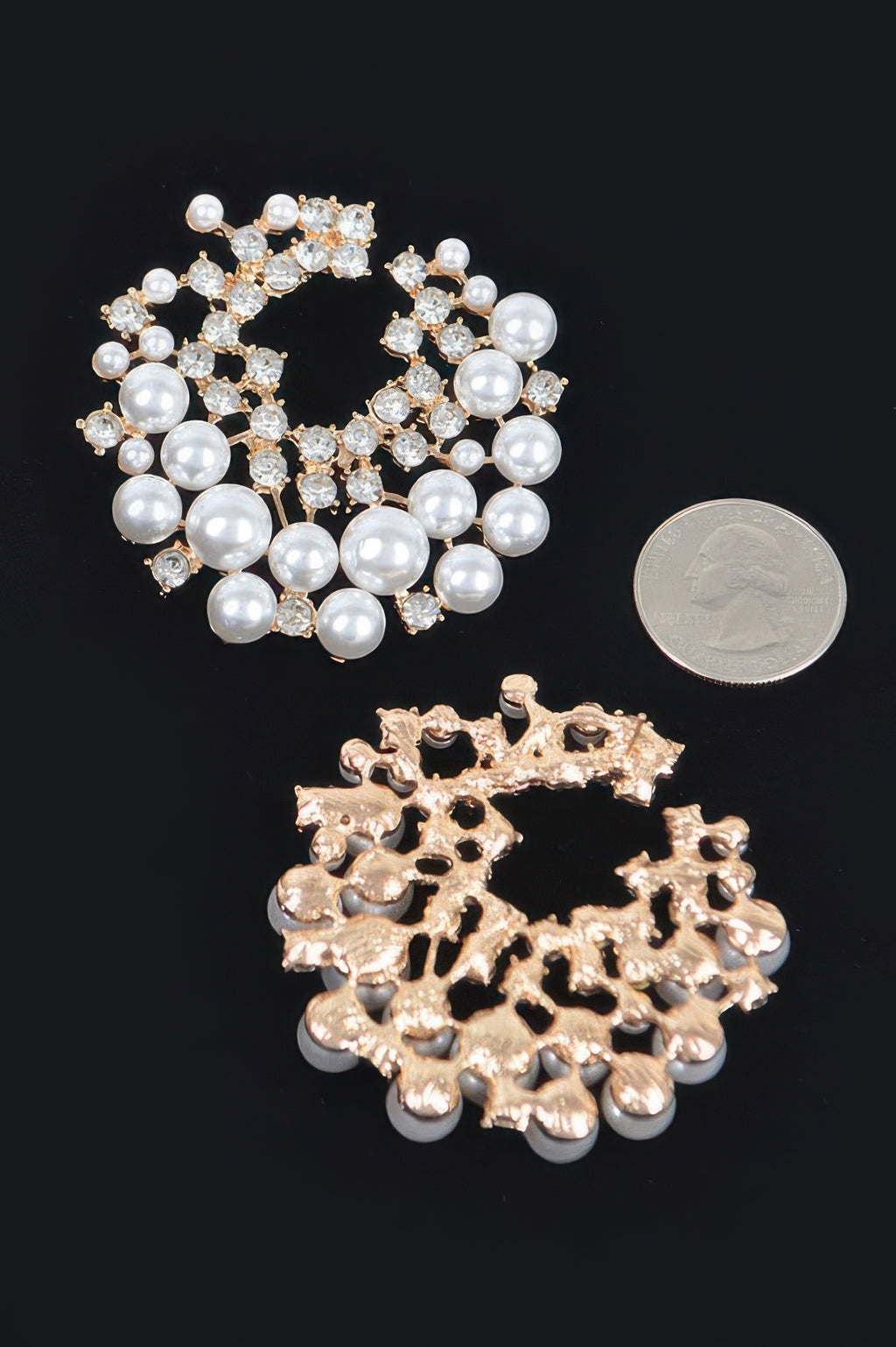 Gold-tone pearl-and-rhinestone hoop stud earrings with clustered crystal detailing.
