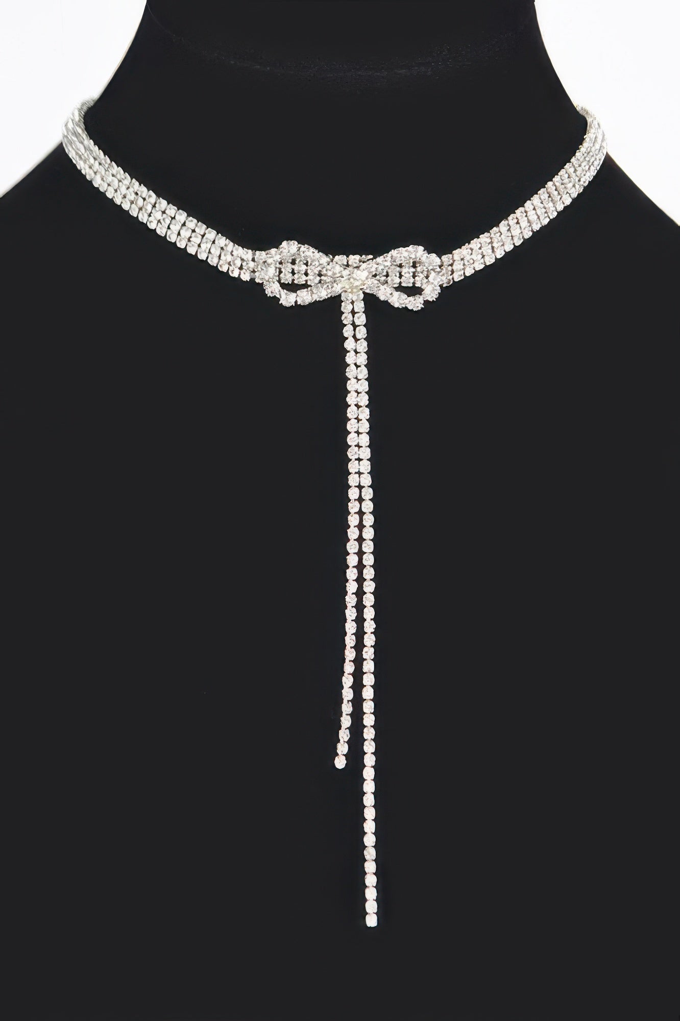 Gold-tone rhinestone bow choker necklace with long pendant-like drop
