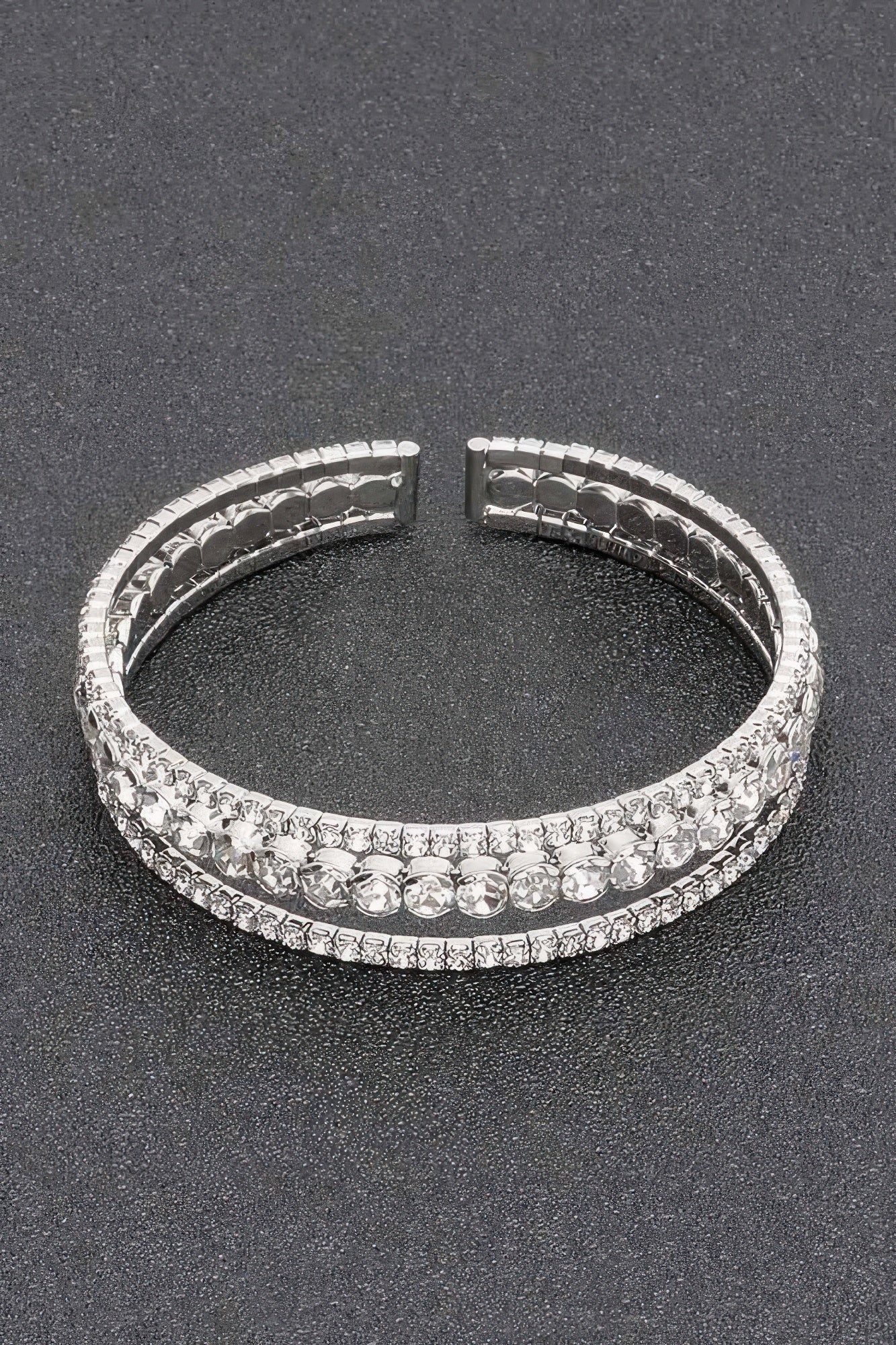Silver-toned rhinestone cuff bracelet with clear round stones, front view