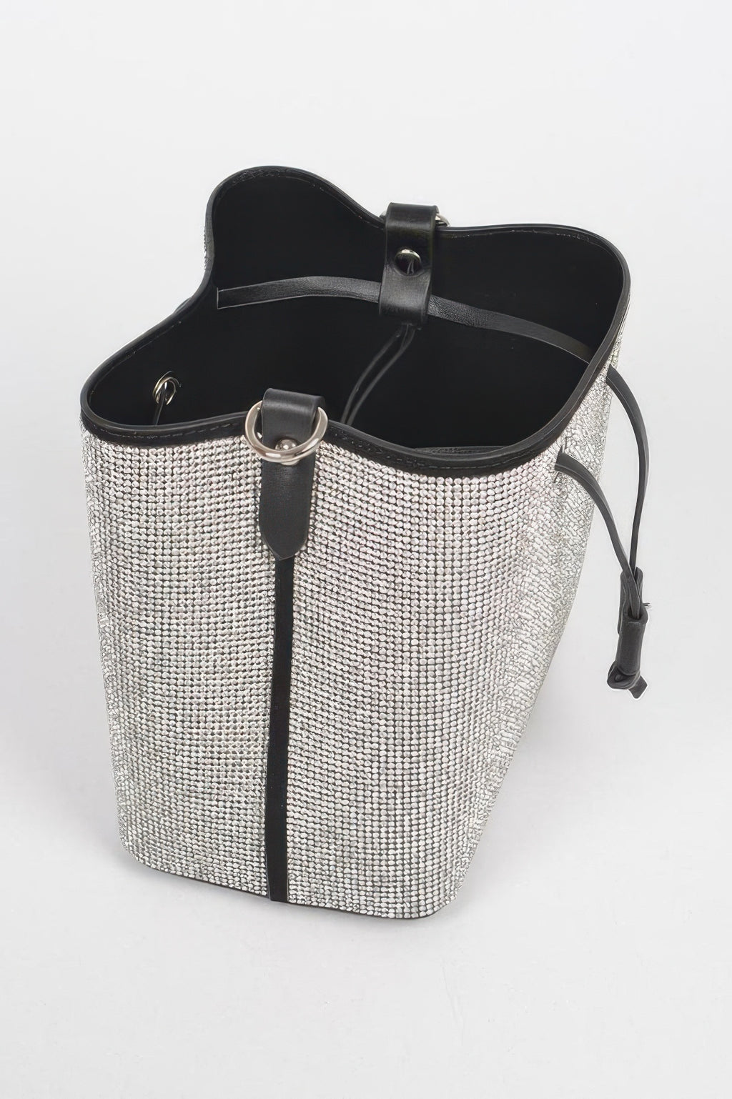 Silver rhinestone bucket bag with black top trim and interior lining