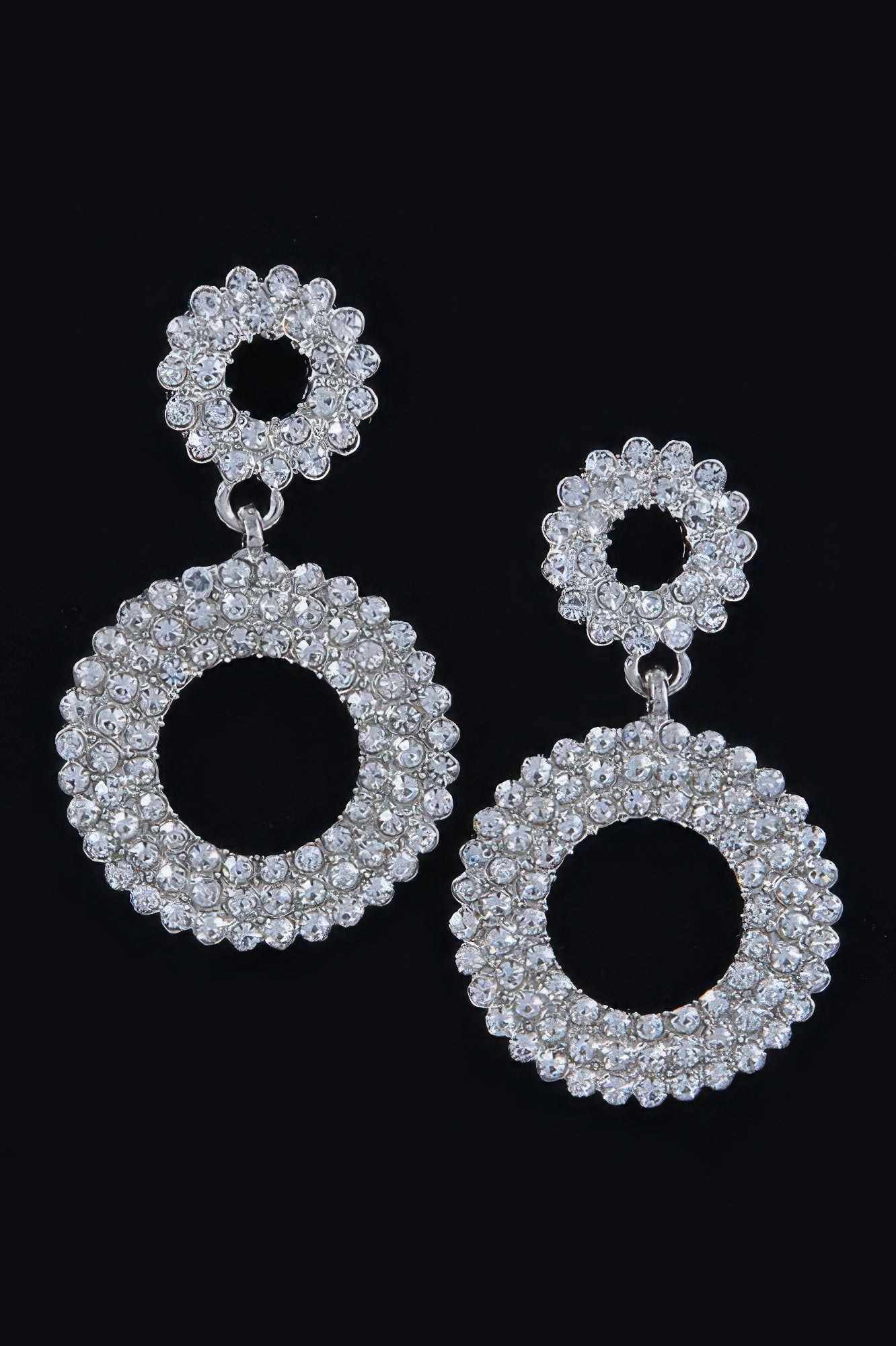 Silver-tone rhinestone dangle earrings with circular halo top and large ring drop