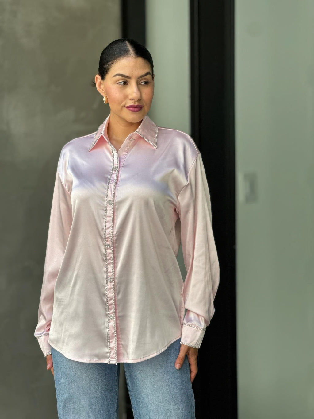 Pale pink satin blouse with rhinestone-trimmed front placket and long sleeves