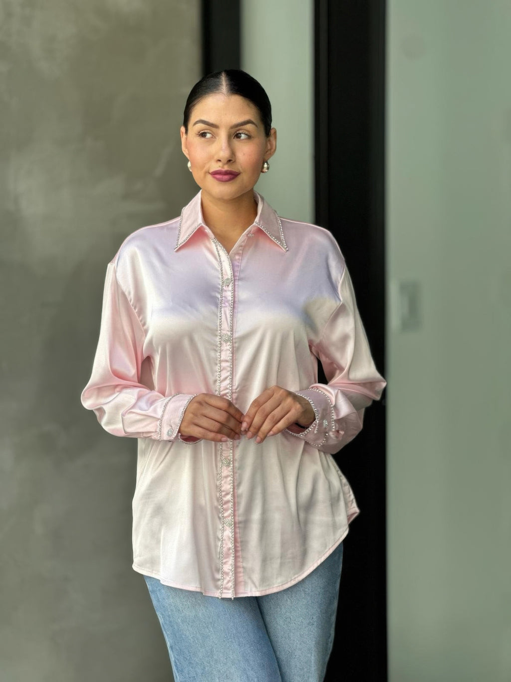 Pale pink satin button-down blouse with rhinestone detailing on placket and cuffs