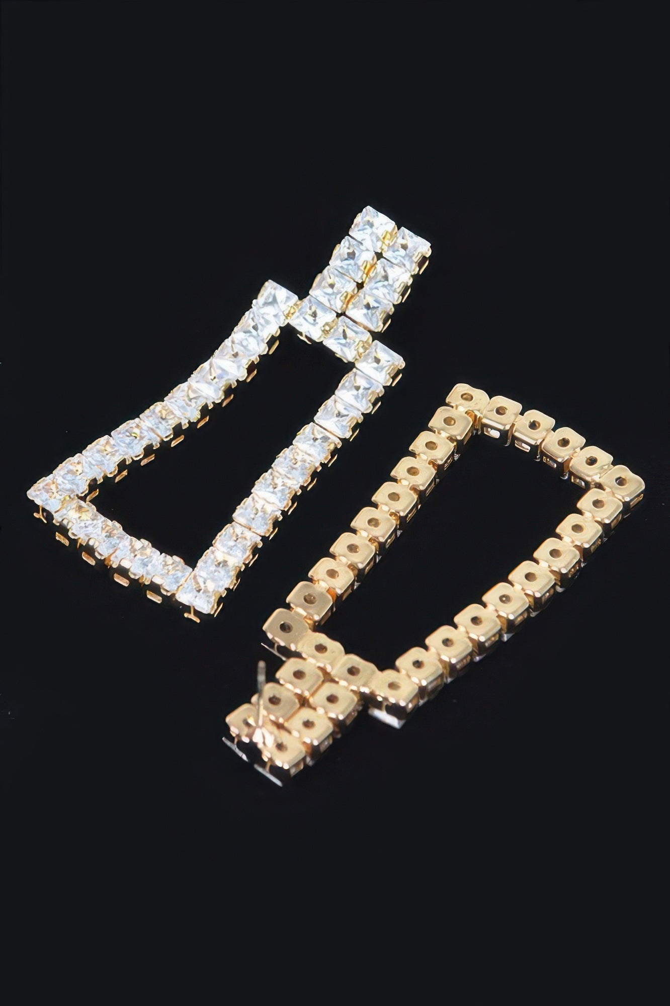 Rhinestone earrings, gold-tone frame with clear rhinestone squares (angled view)
