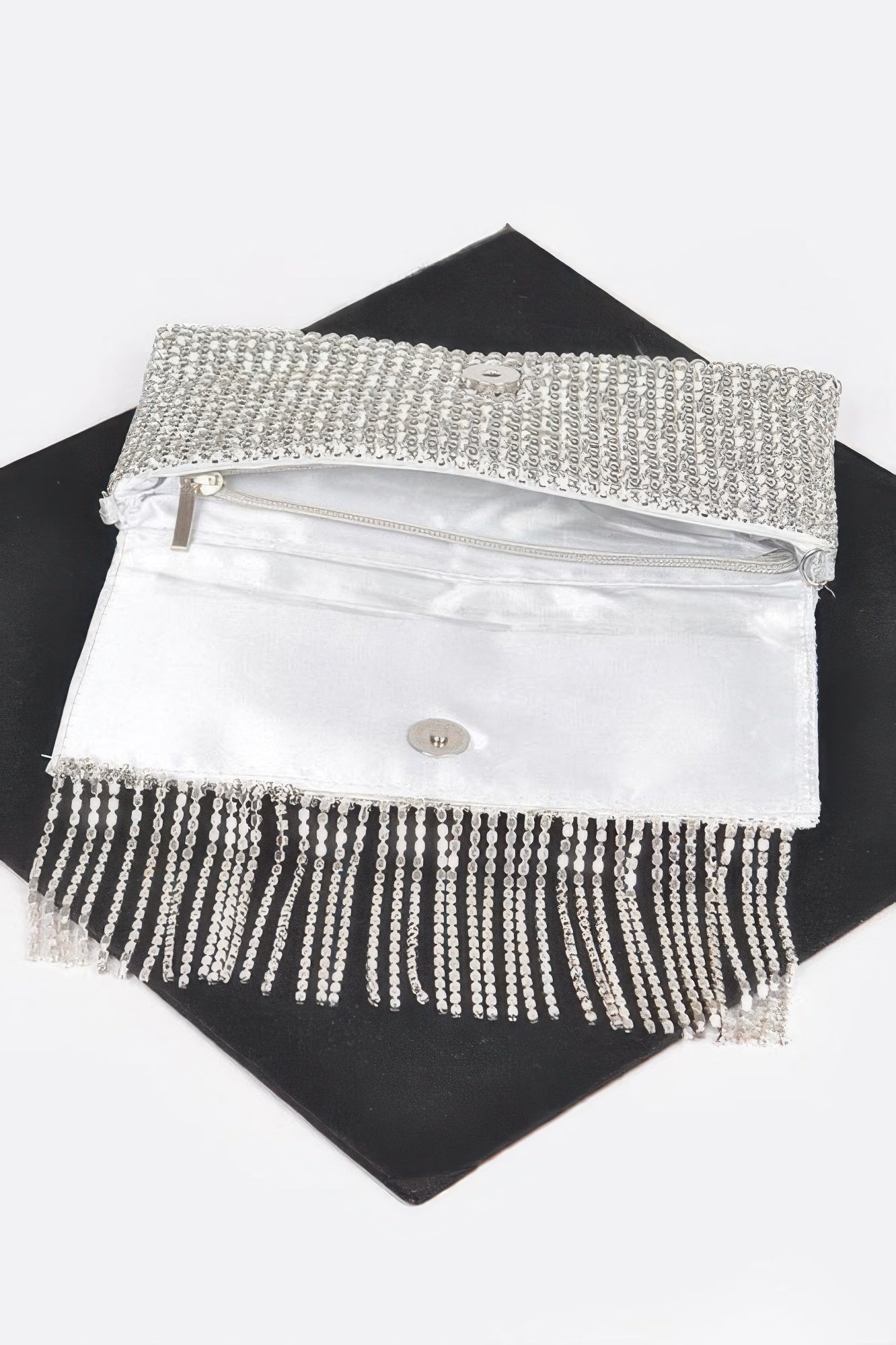 Rhinestone clutch with snap flap and silver-toned beaded fringe