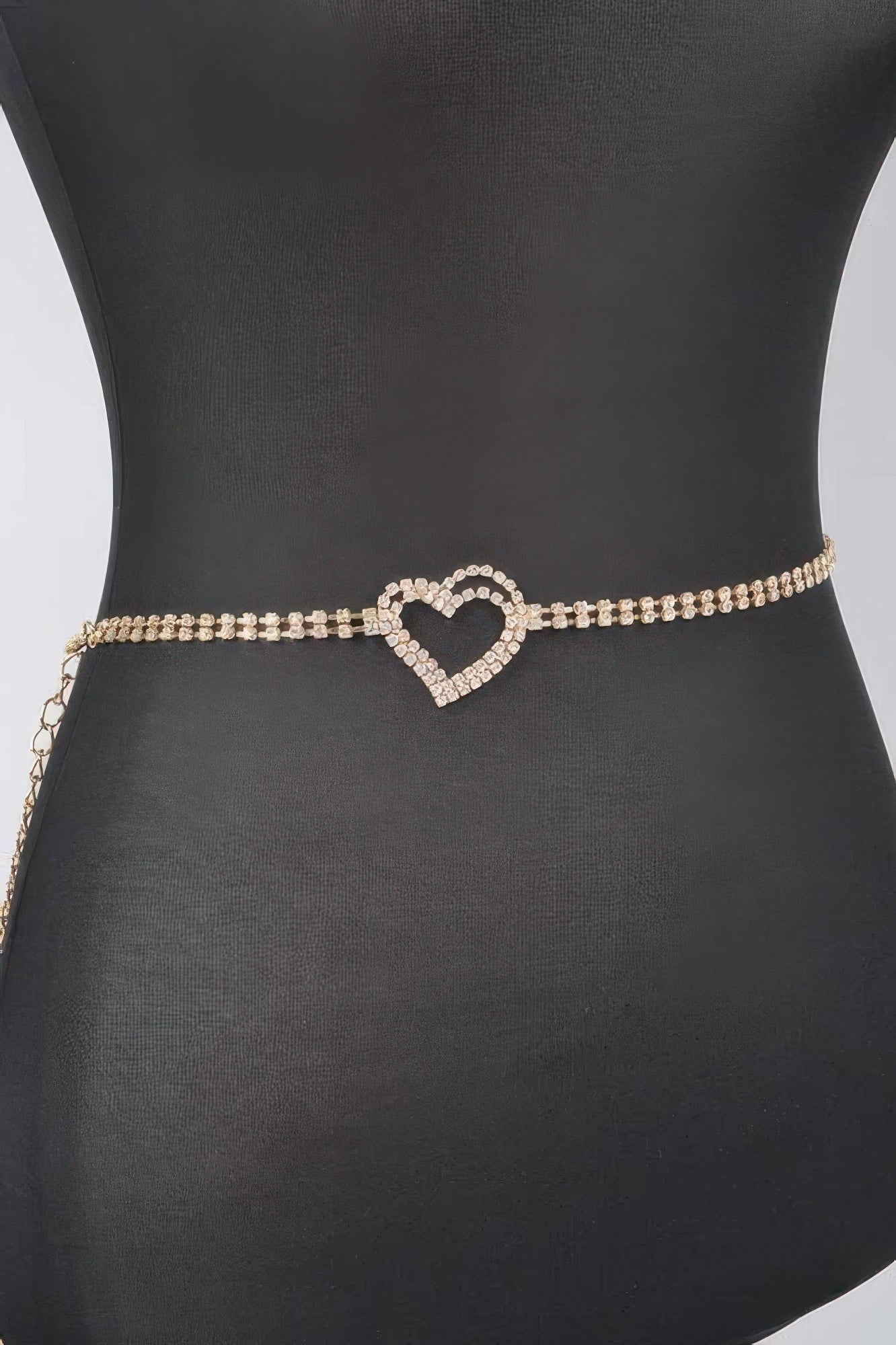 Rhinestone heart chain belt showing heart charm centered on the gold-tone band