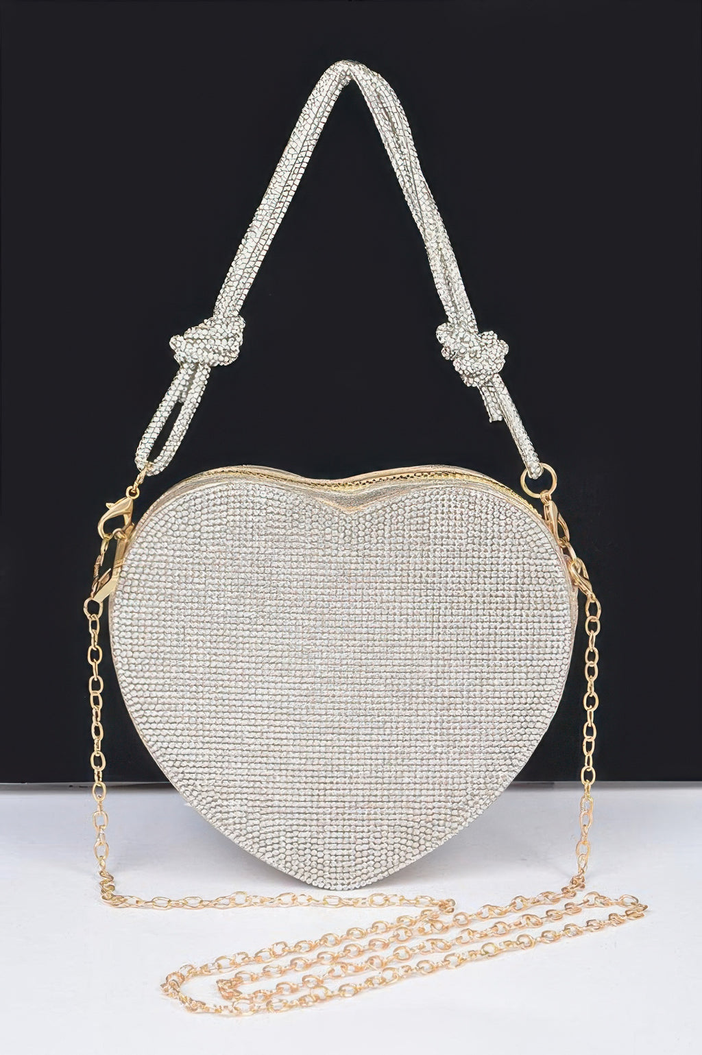 Rhinestone heart clutch bag in silver with top handles and gold chain strap