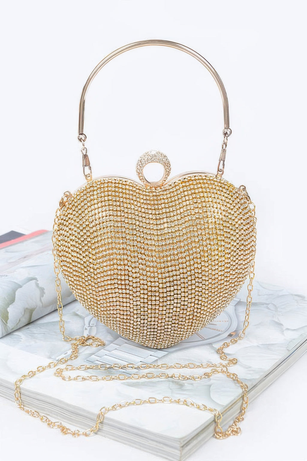 Rhinestone heart clutch in clear gold with top handle and chain strap
